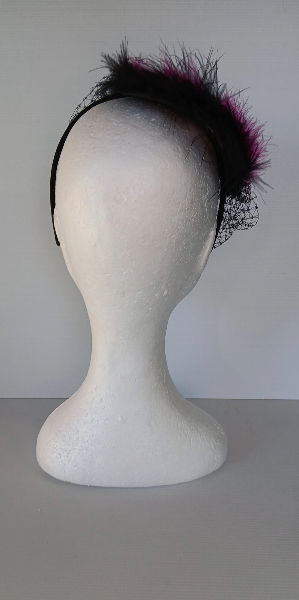 A picture of a Pink and Black Veiled and Feathered Millinery Fascinator by Melissa Rath Millinery.