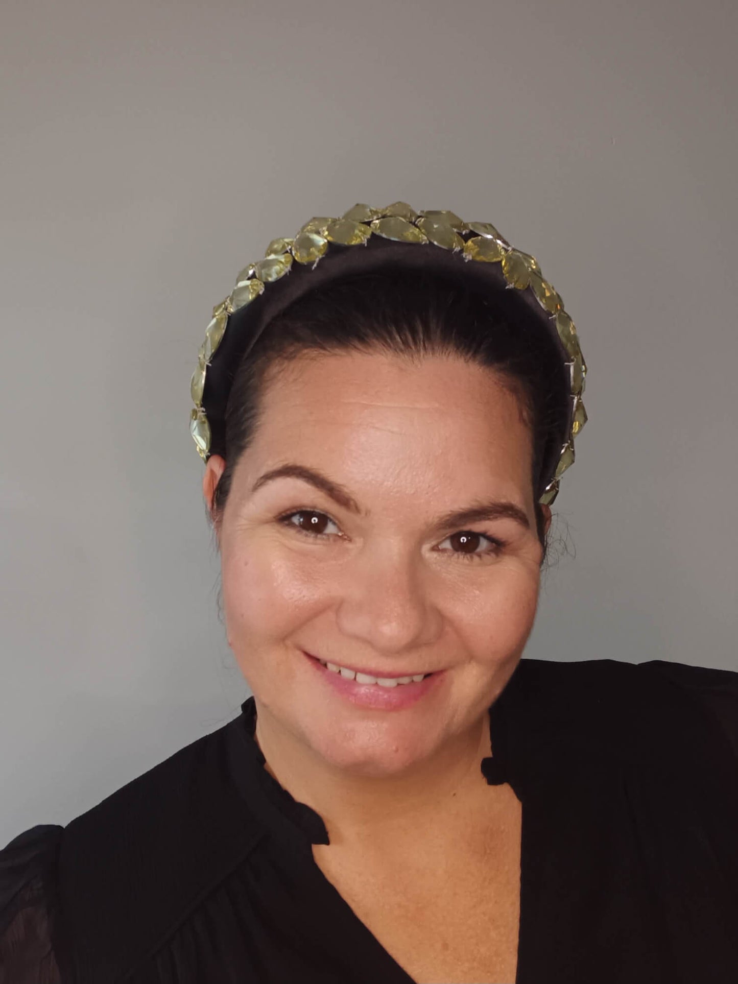 A picture of a Black and Silver Padded Headband by Melissa Rath Millinery.