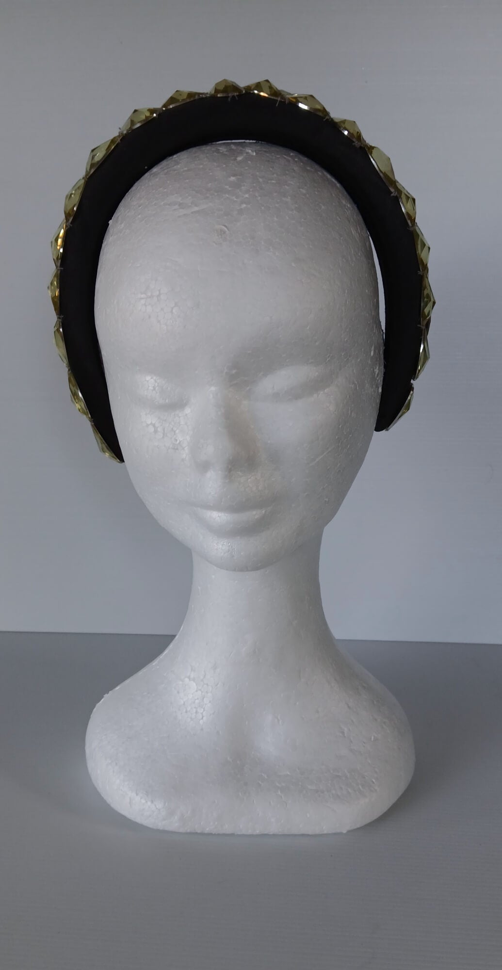 A picture of a Black and Silver Padded Headband by Melissa Rath Millinery.