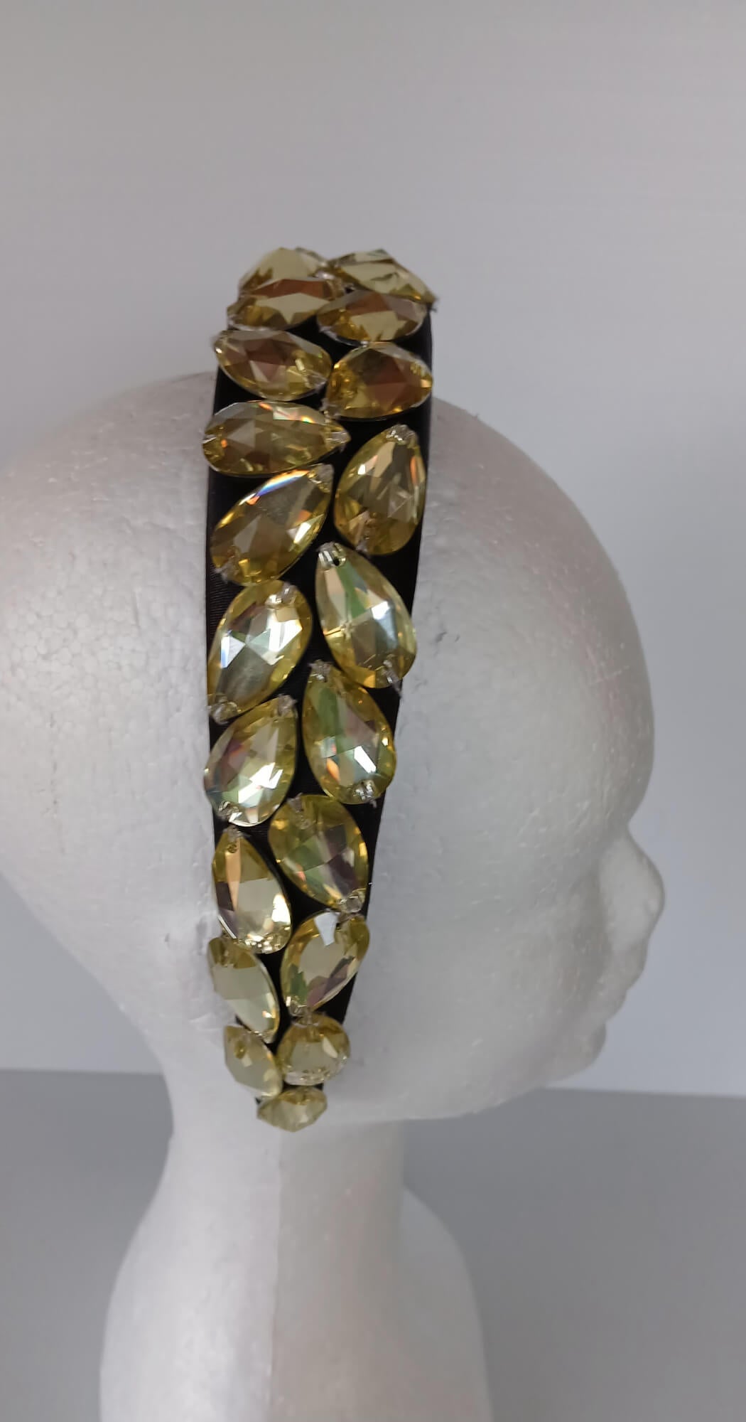 A picture of a Black and Silver Padded Headband by Melissa Rath Millinery.