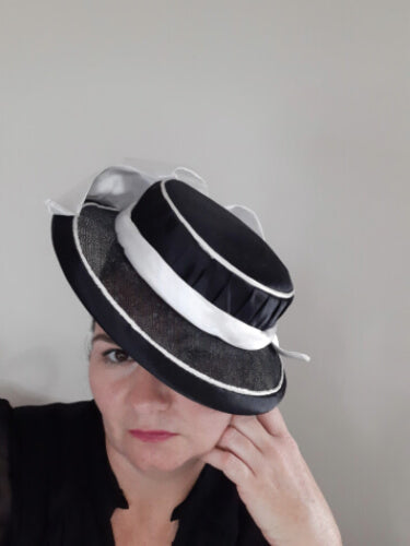 A picture of a Black and White Millinery Boater by Melissa Rath Millinery