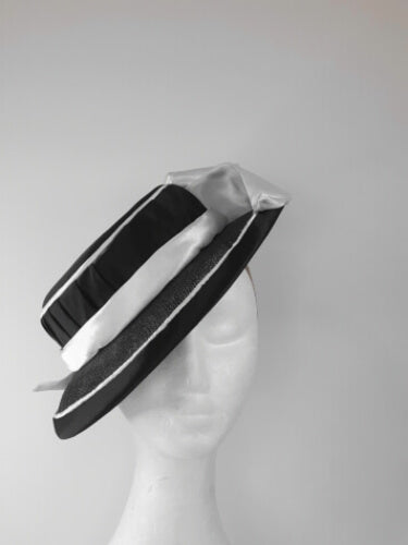 A picture of a Black and White Millinery Boater by Melissa Rath Millinery