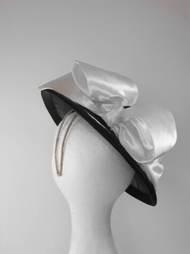 A picture of a Black and White Millinery Boater by Melissa Rath Millinery
