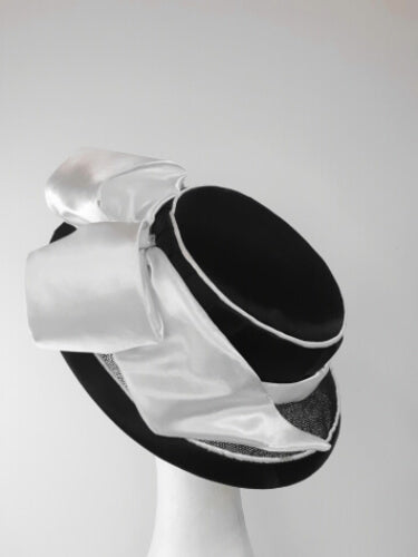 A picture of a Black and White Millinery Boater by Melissa Rath Millinery