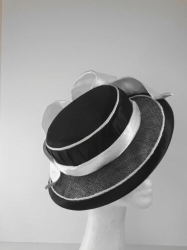 A picture of a Black and White Millinery Boater by Melissa Rath Millinery