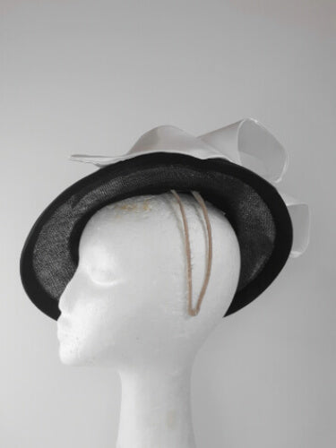 A picture of a Black and White Millinery Boater by Melissa Rath Millinery