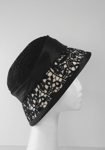 A picture of a Black and White Coche by Melissa Rath Millinery.