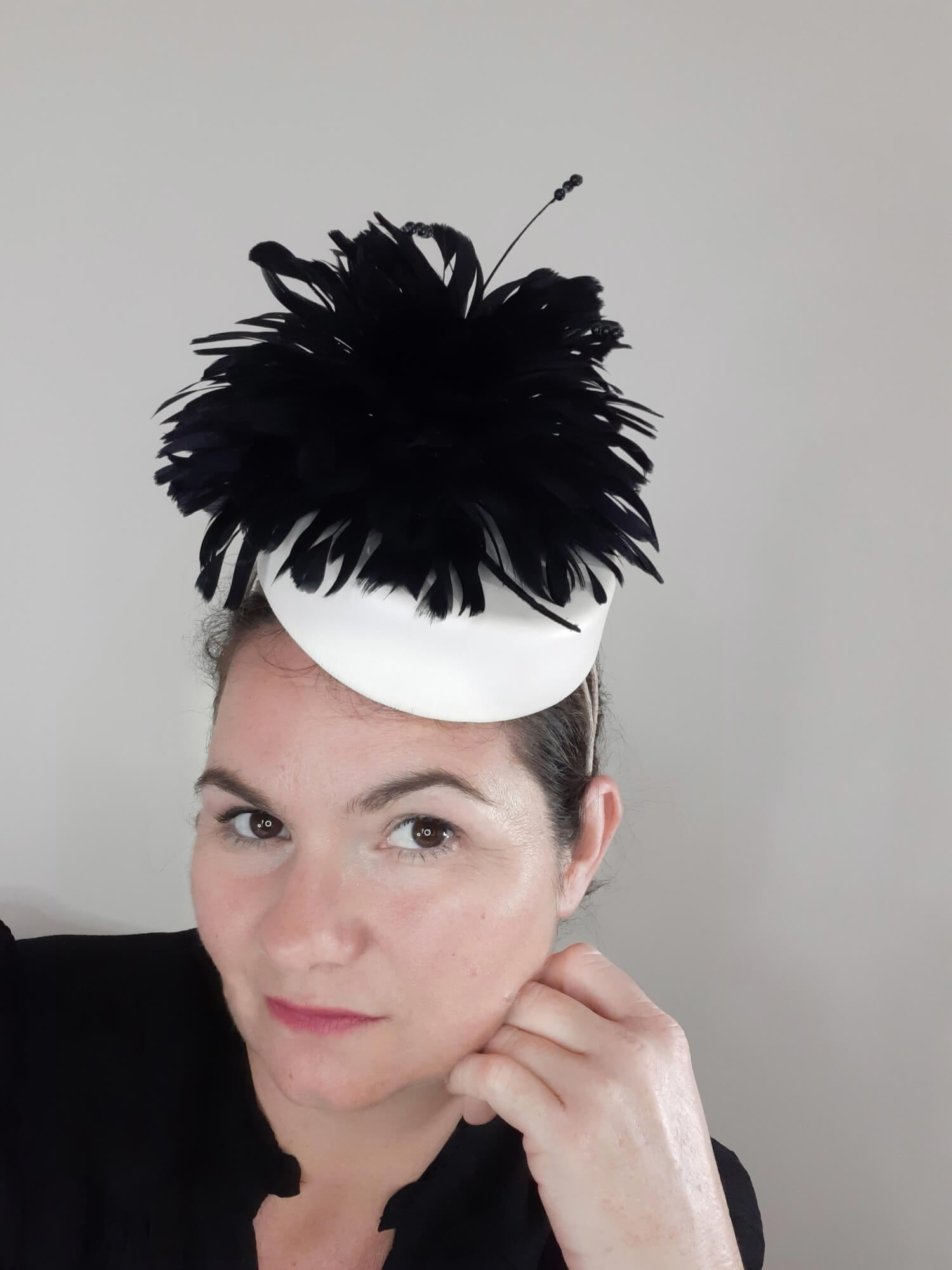A picture of a Black and White Leather Millinery Headpiece by Melissa Rath Millinery.