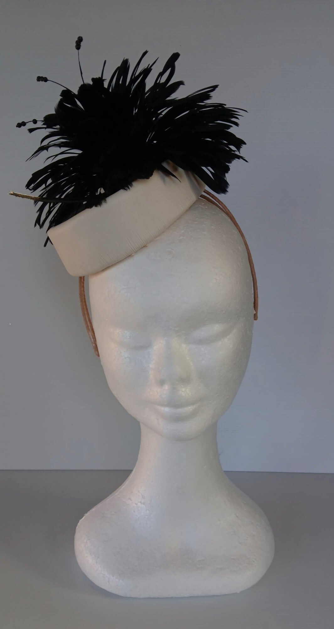 A picture of a Black and White Leather Millinery Headpiece by Melissa Rath Millinery.