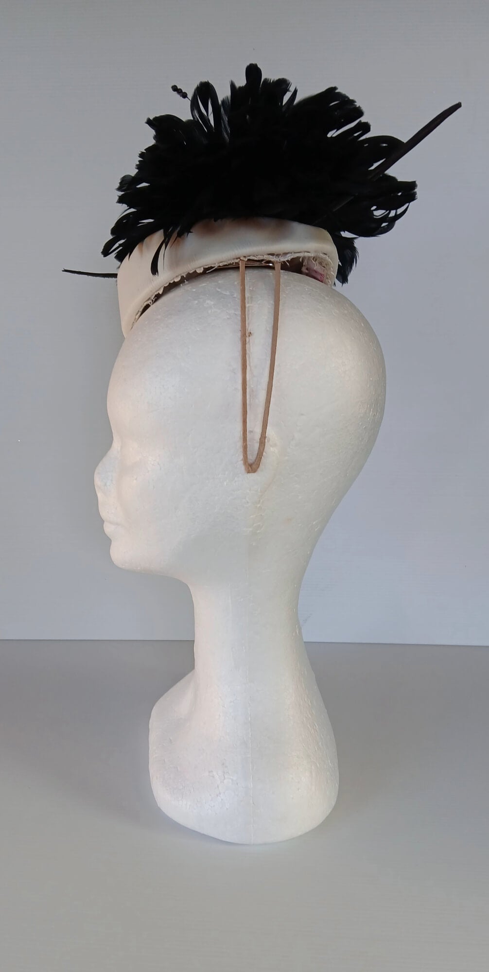 A picture of a Black and White Leather Millinery Headpiece by Melissa Rath Millinery.