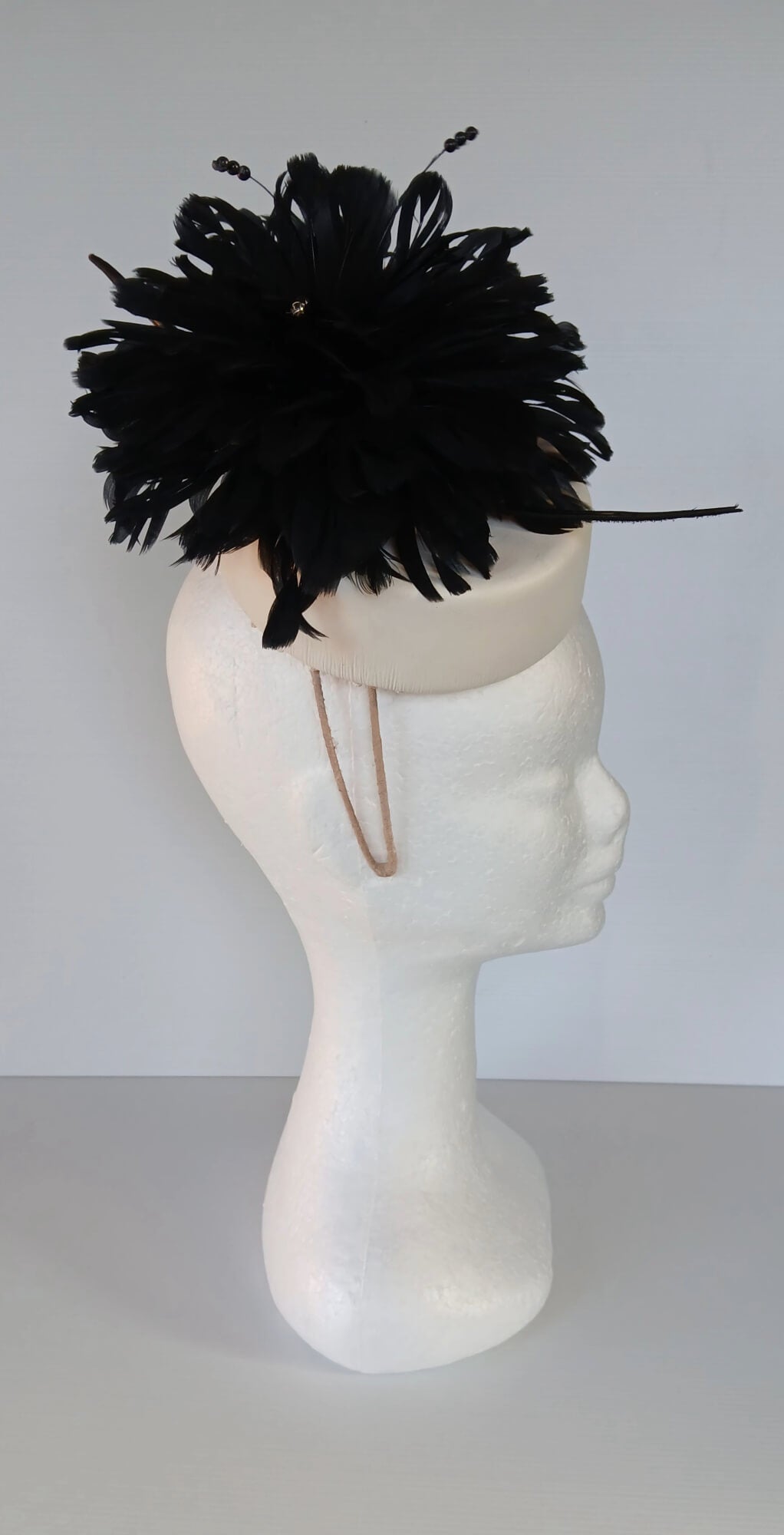 A picture of a Black and White Leather Millinery Headpiece by Melissa Rath Millinery.