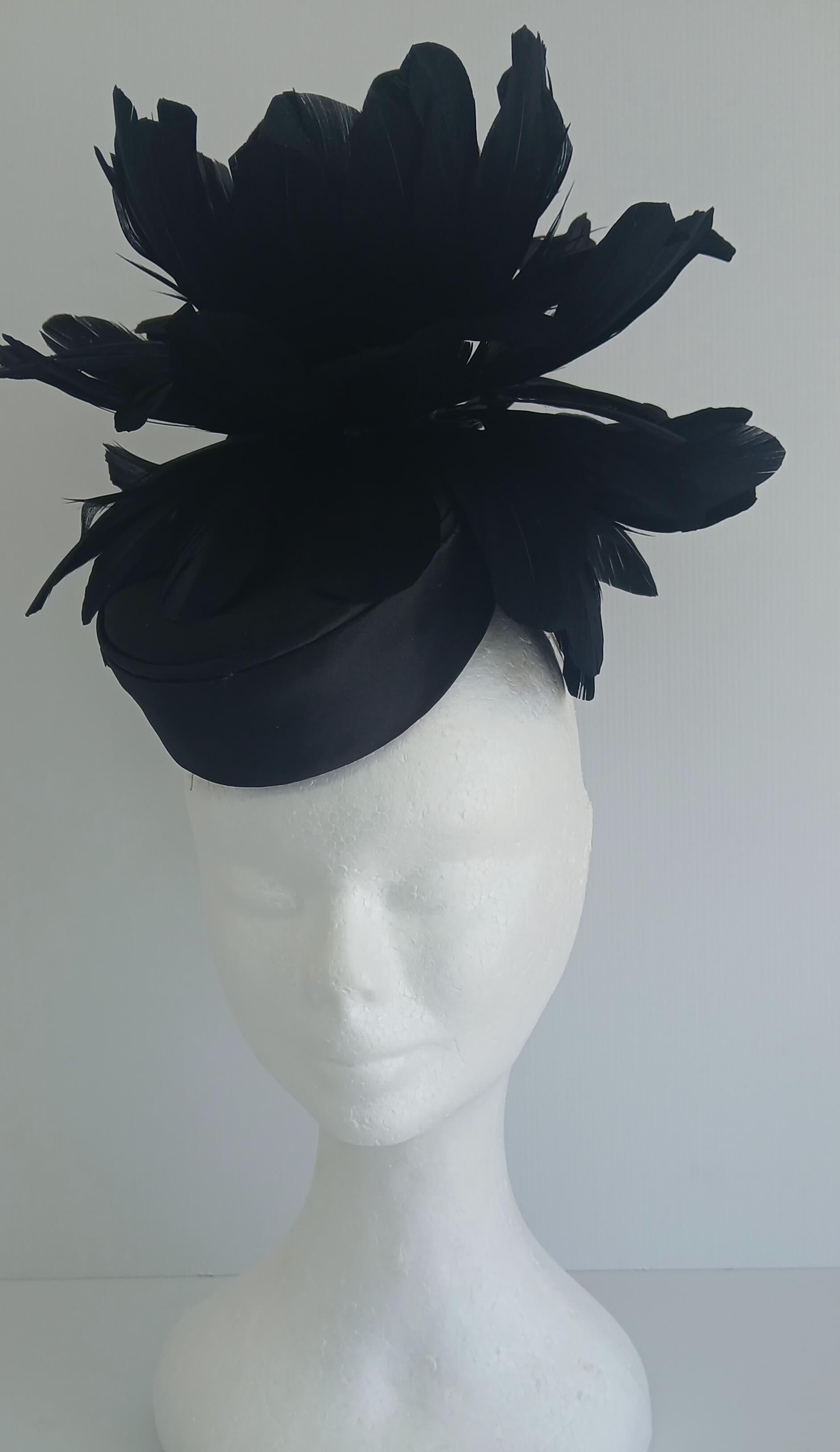 An image of the Black Satin Fascinator with Floral Flower Trim by Melissa Rath Millinery