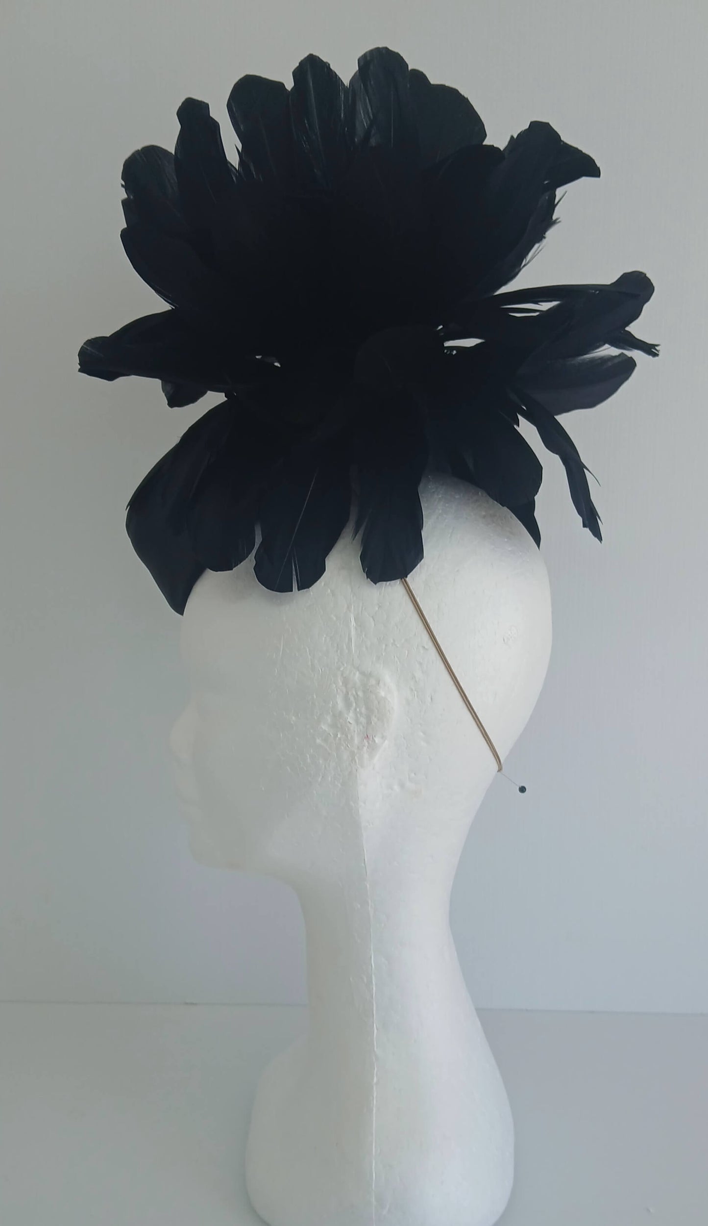 An image of the Black Satin Fascinator with Floral Flower Trim by Melissa Rath Millinery