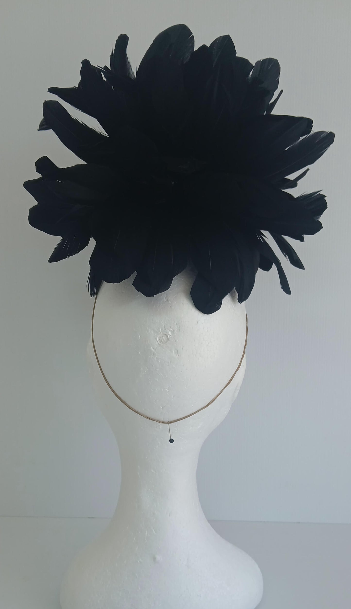 An image of the Black Satin Fascinator with Floral Flower Trim by Melissa Rath Millinery