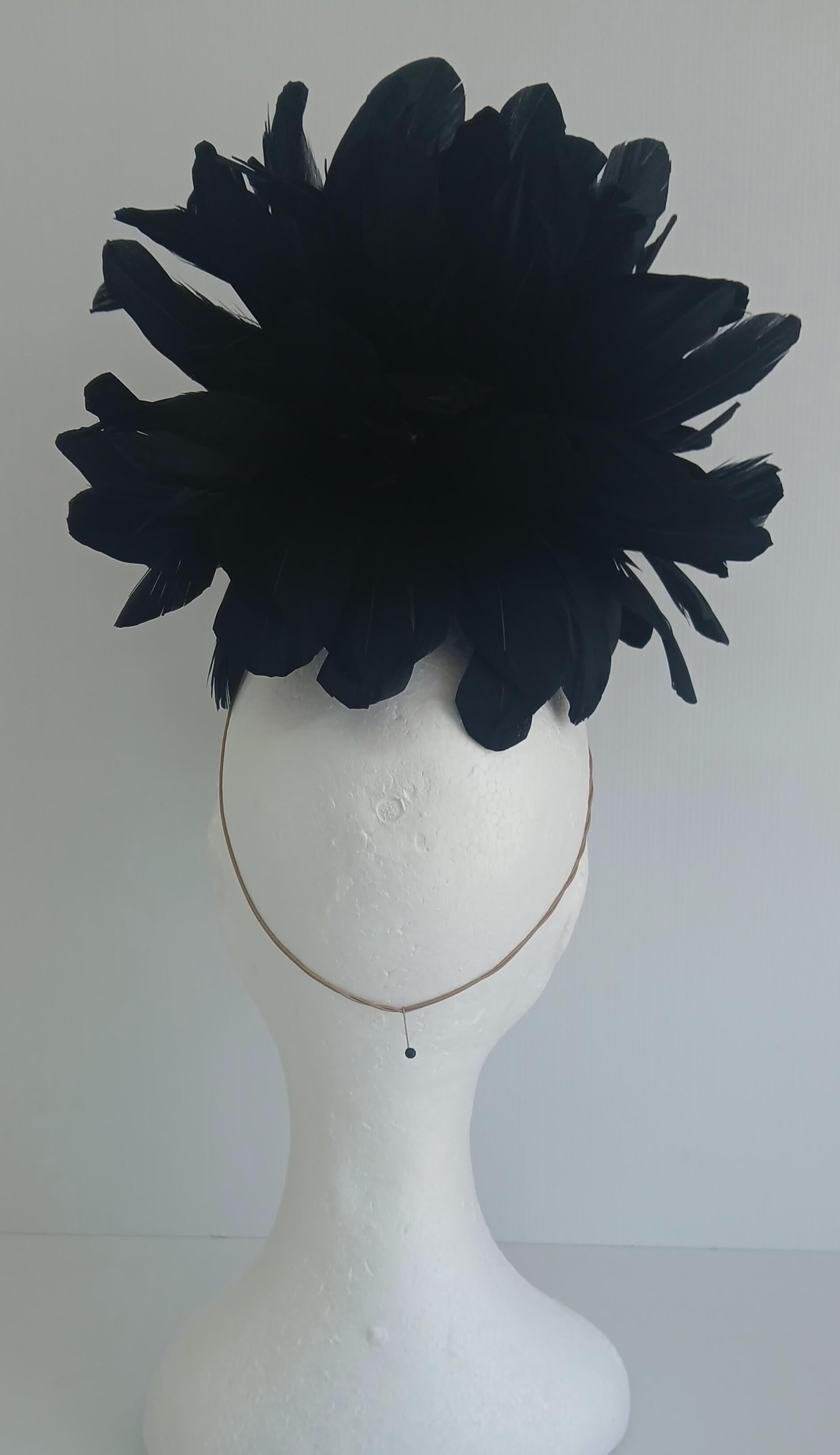 An image of the Black Satin Fascinator with Floral Flower Trim by Melissa Rath Millinery