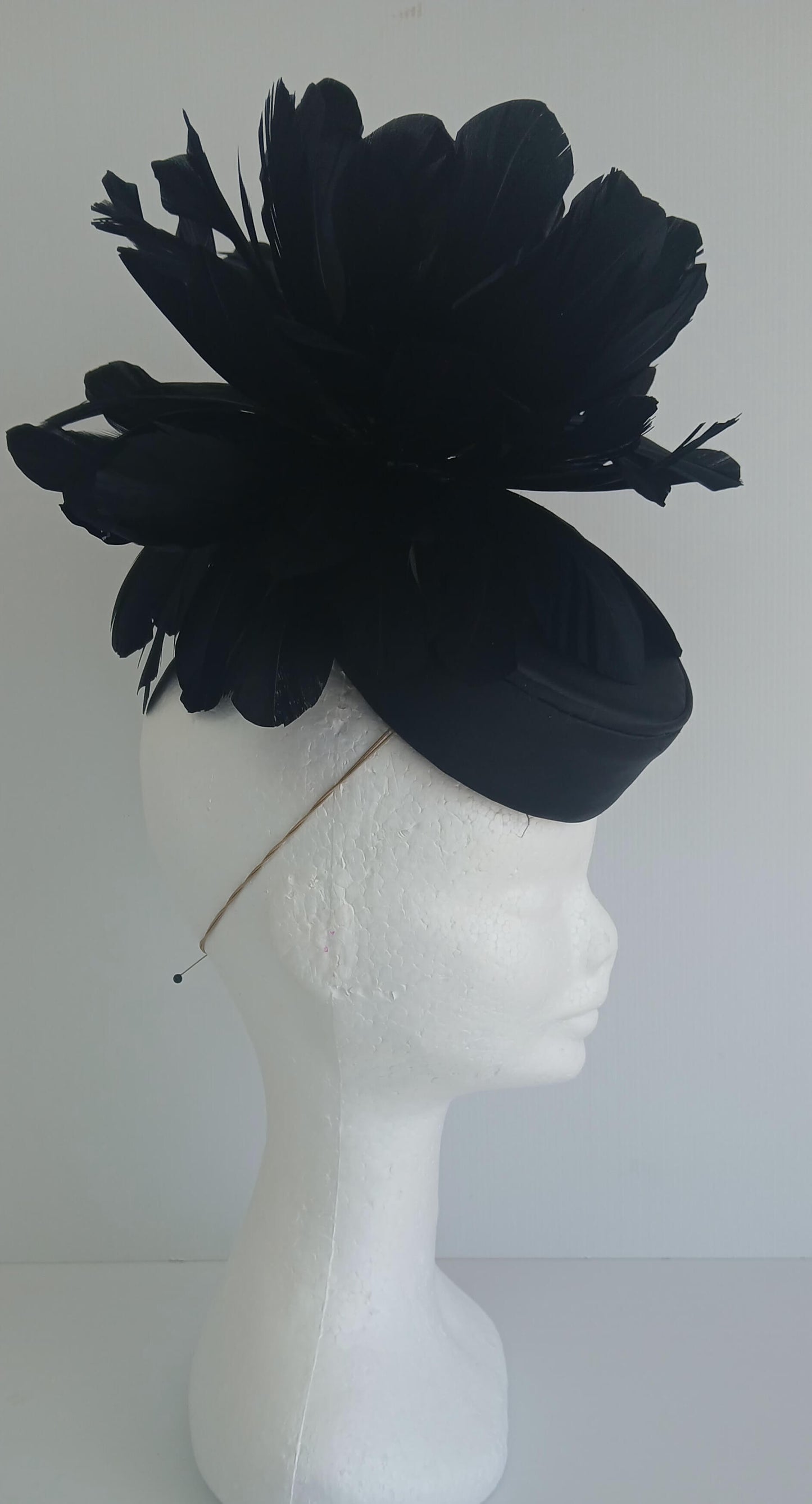 An image of the Black Satin Fascinator with Floral Flower Trim by Melissa Rath Millinery