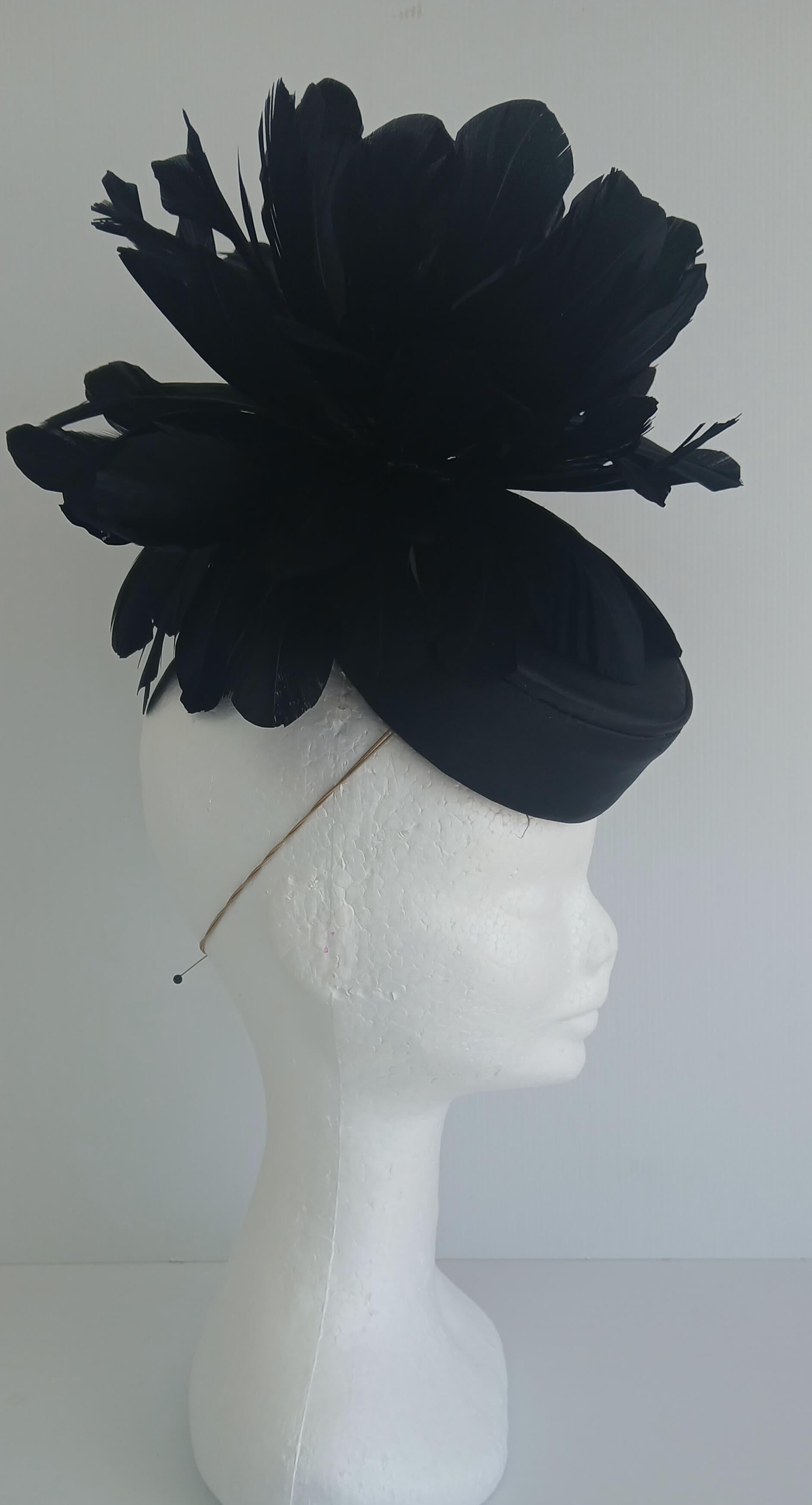 An image of the Black Satin Fascinator with Floral Flower Trim by Melissa Rath Millinery