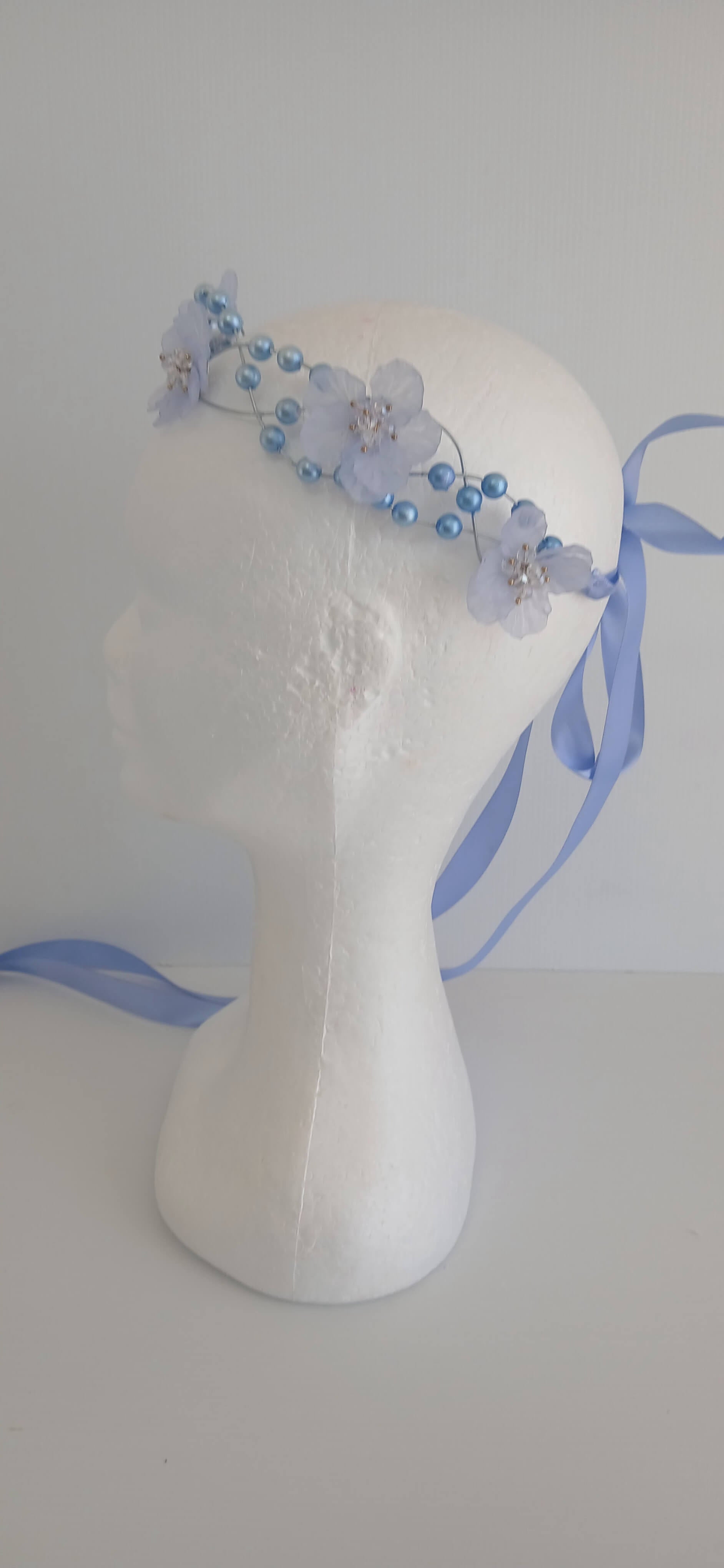 An image of the  Blue Beaded Halo Crown by Melissa Rath Millinery
