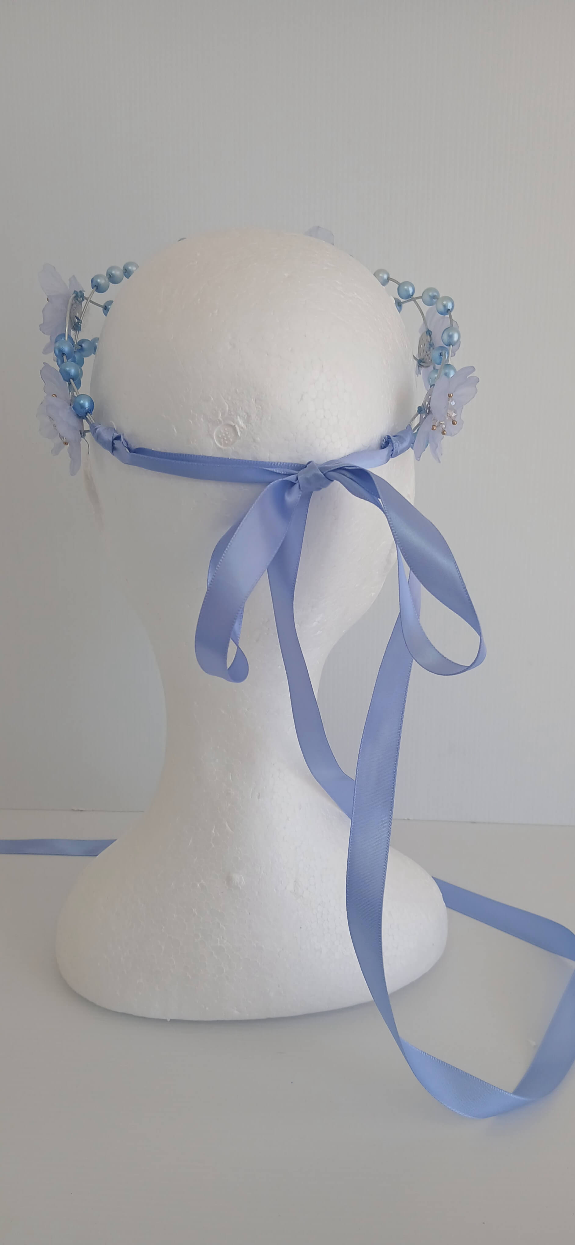 An image of the  Blue Beaded Halo Crown by Melissa Rath Millinery