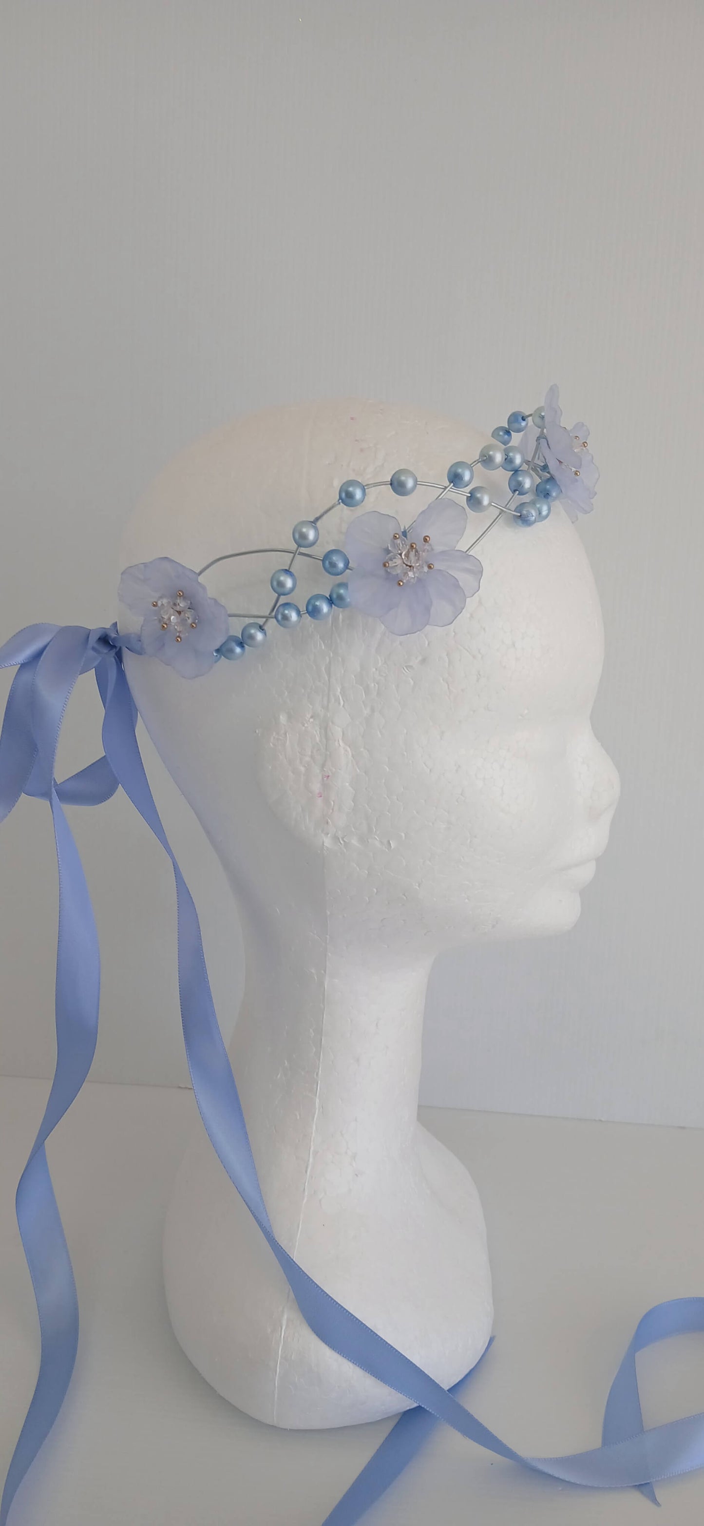 An image of the  Blue Beaded Halo Crown by Melissa Rath Millinery