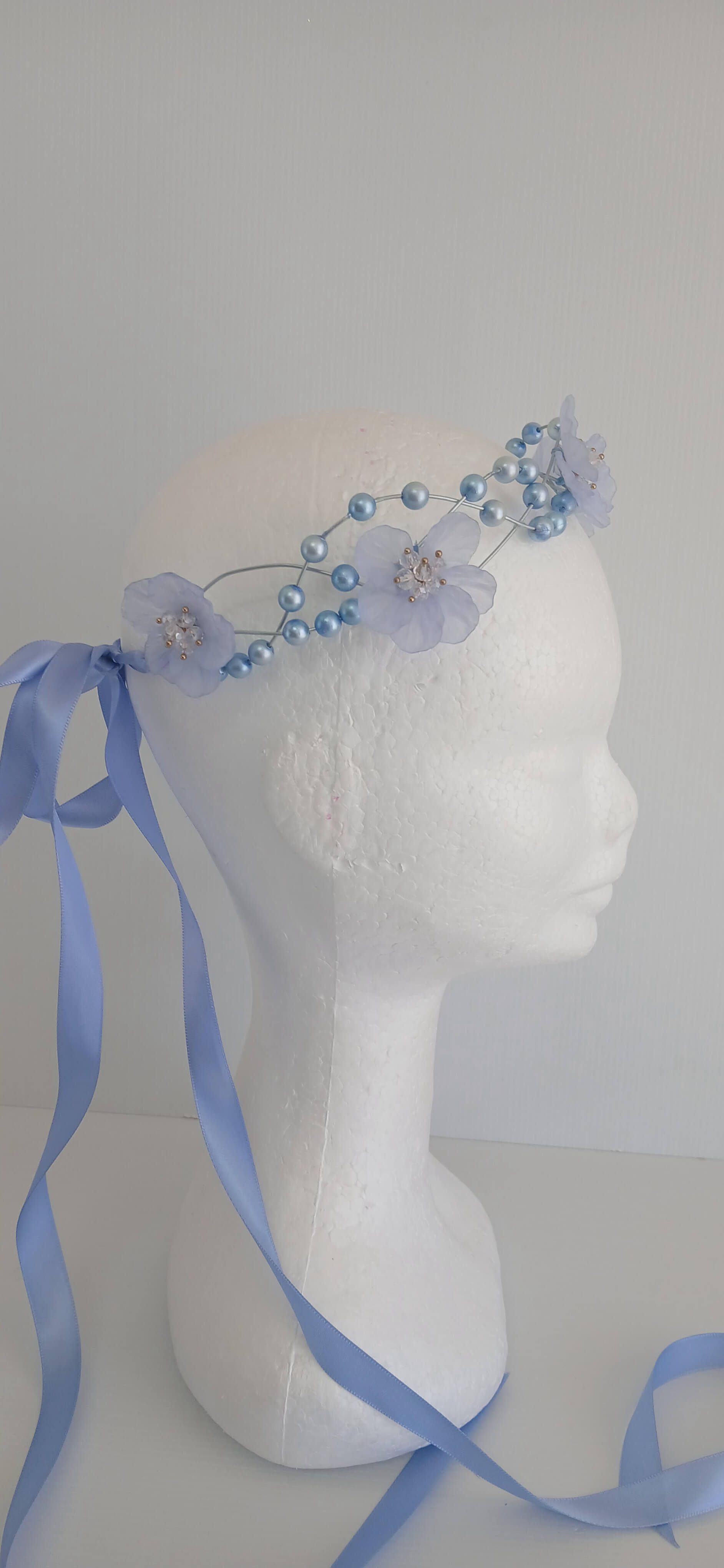 An image of the  Blue Beaded Halo Crown by Melissa Rath Millinery