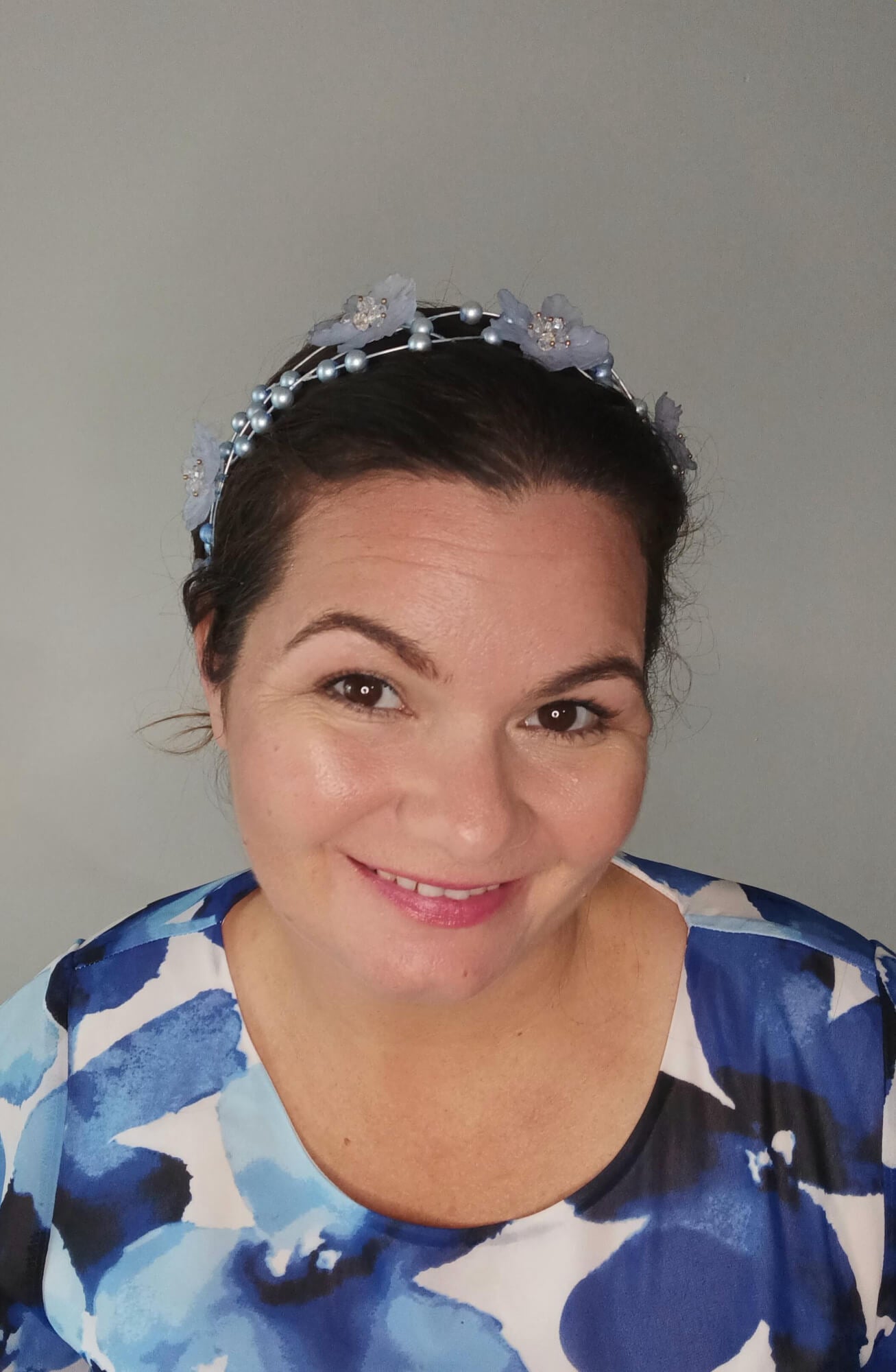 A picture of a pale blue halo headband by Melissa Rath Millinery