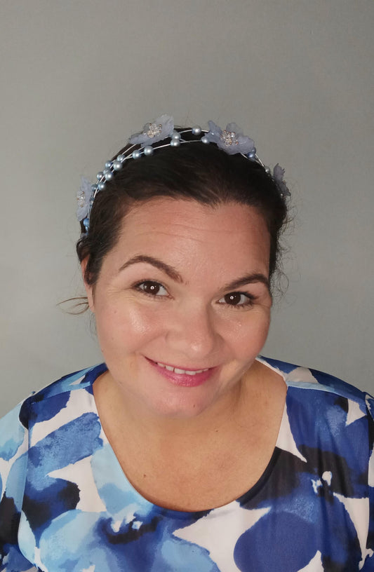 A picture of a pale blue halo headband by Melissa Rath Millinery