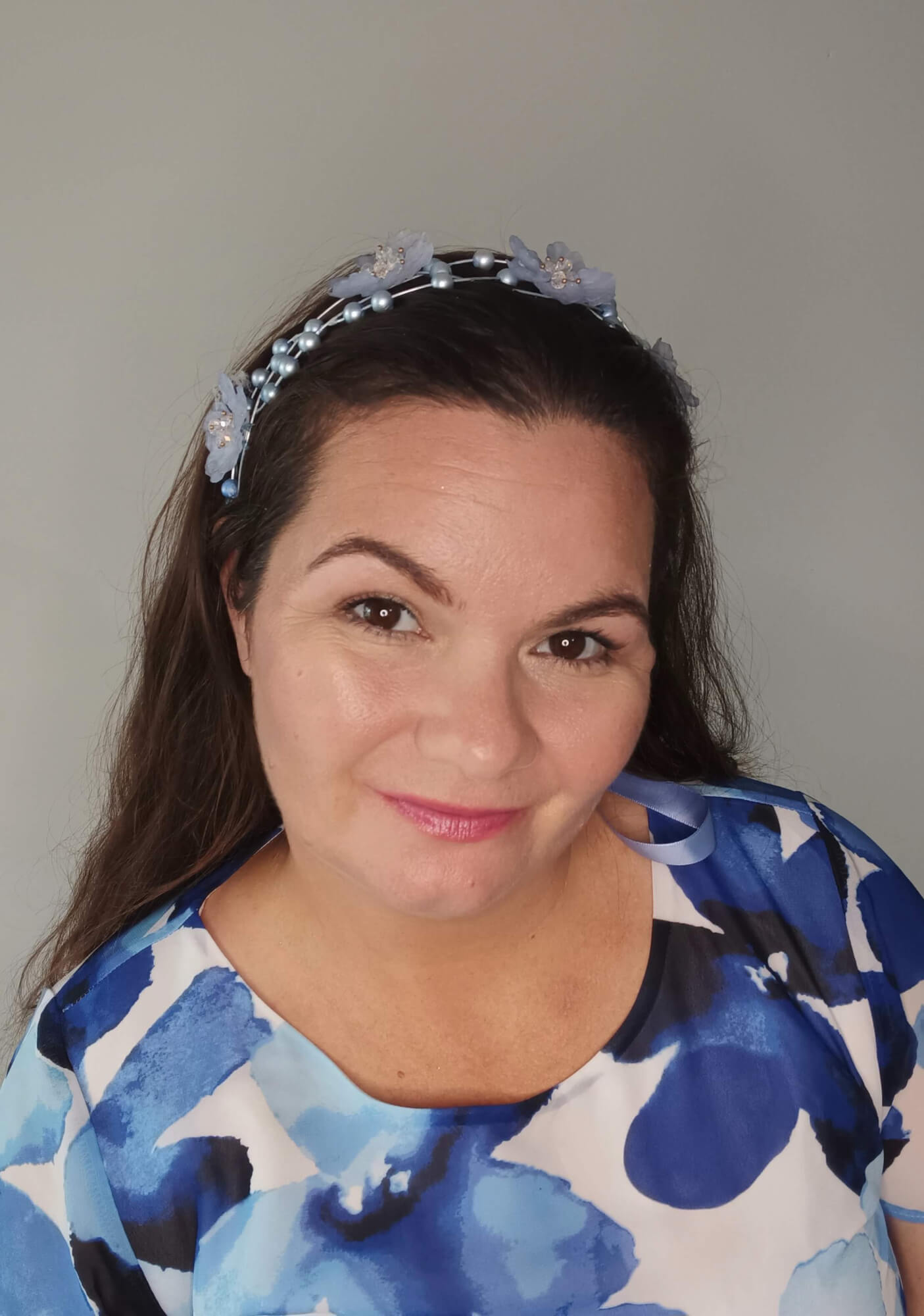 A picture of a pale blue halo headband by Melissa Rath Millinery