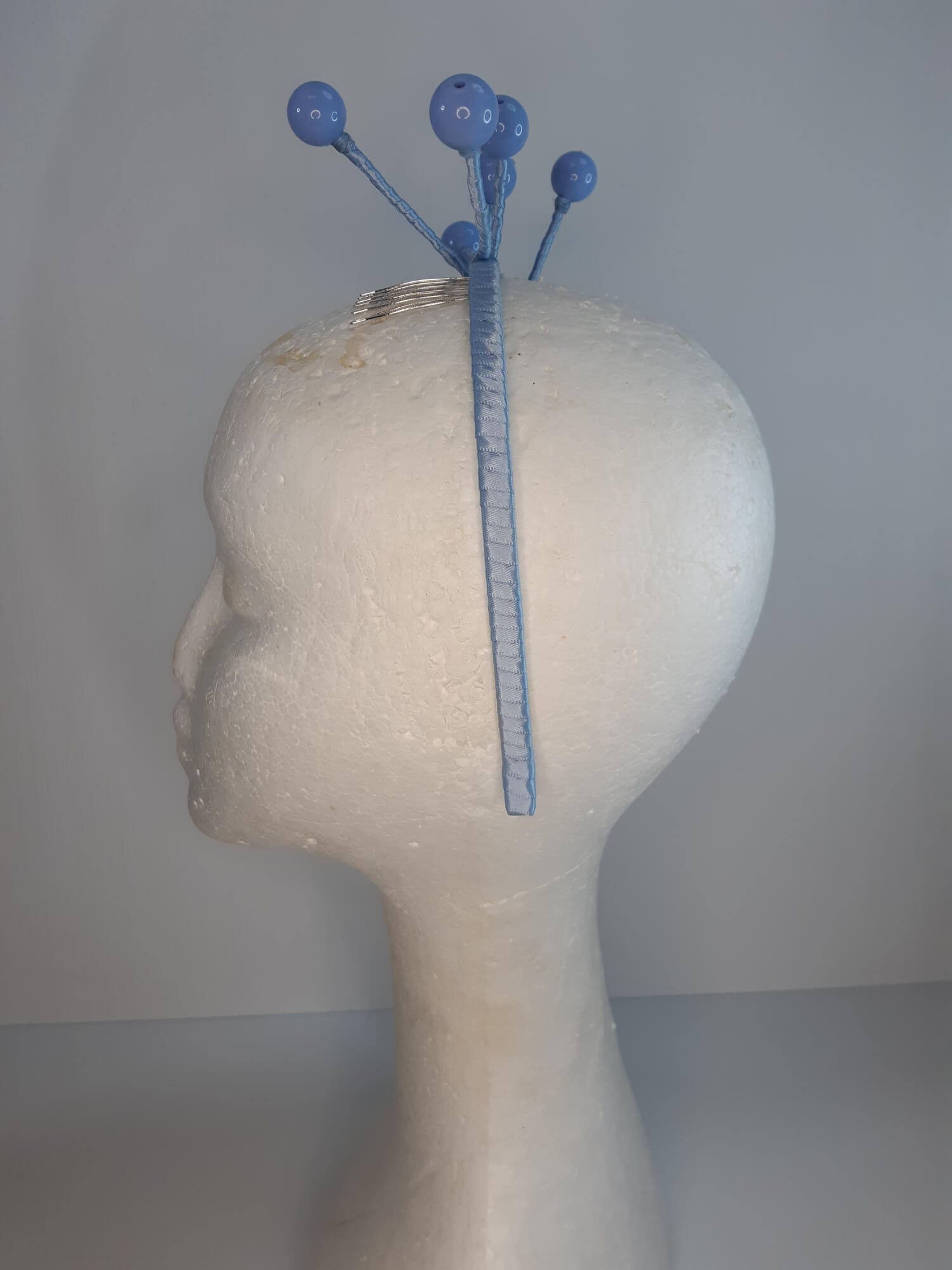 A picture of a Blue Beaded Headband by Melissa Rath Millinery.