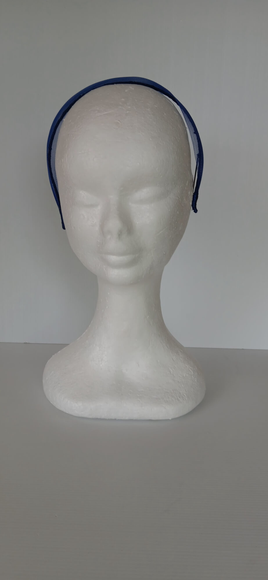 A picture of a blue crinoline headband by Melissa Rath Millinery.