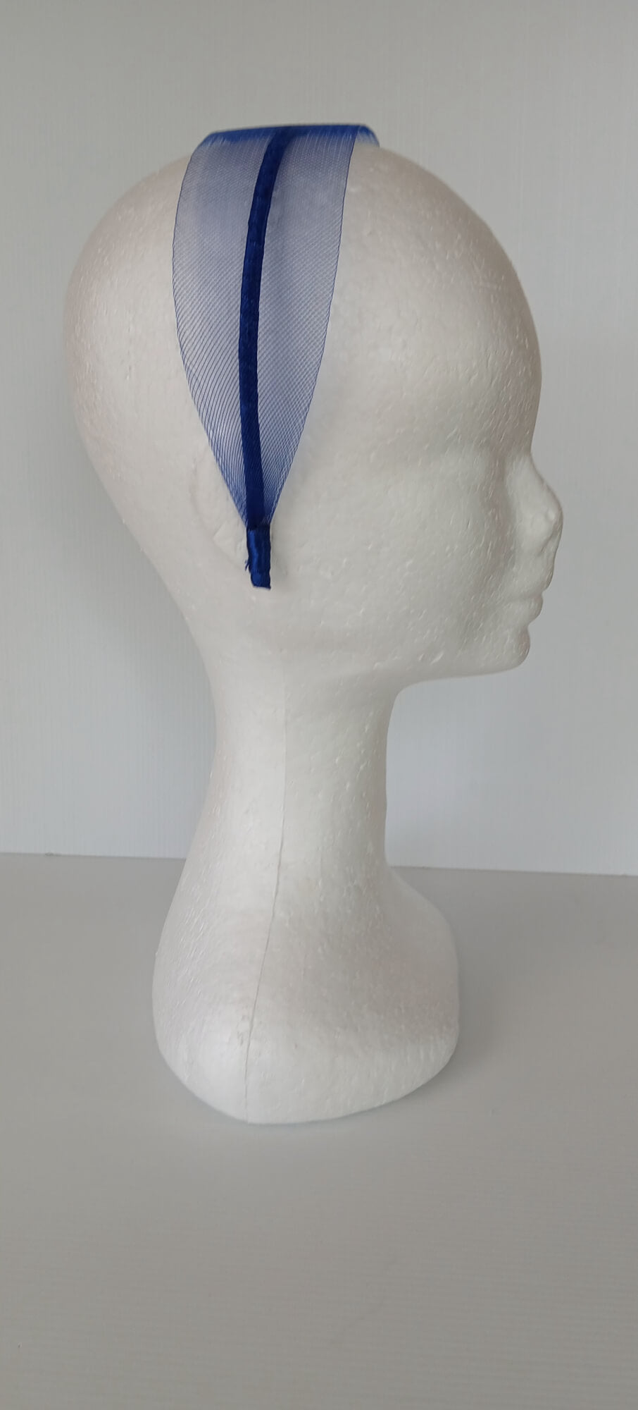 A picture of a blue crinoline headband by Melissa Rath Millinery.