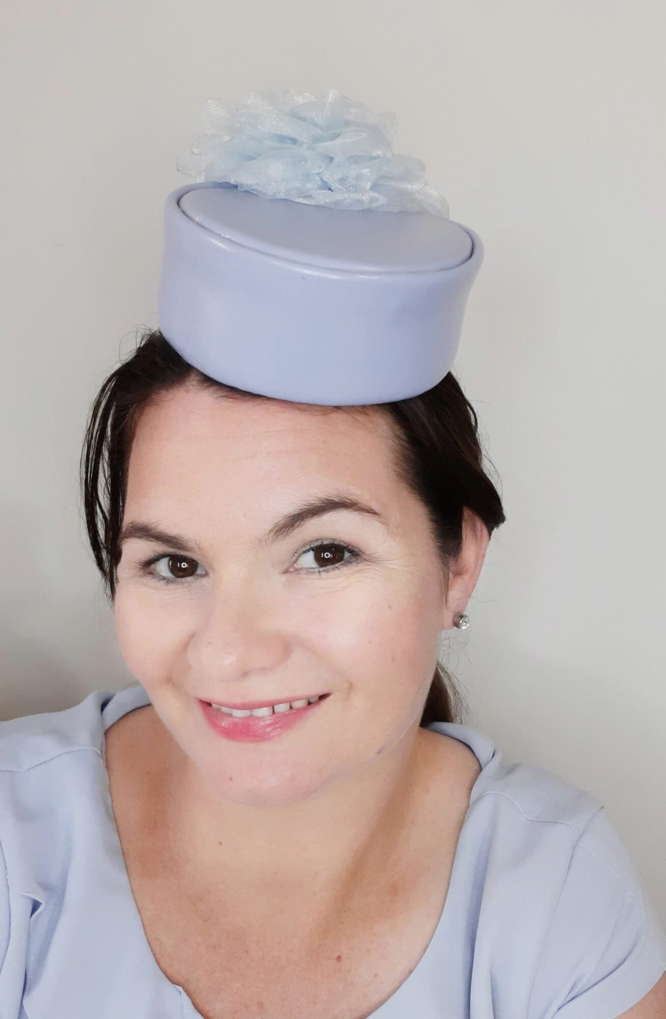 A picture of a Blue Leather Millinery Headpiece by Melissa Rath Millinery.