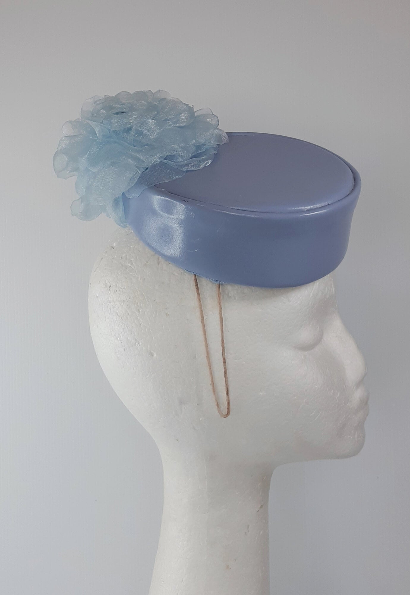 A picture of a Blue Leather Millinery Headpiece by Melissa Rath Millinery.