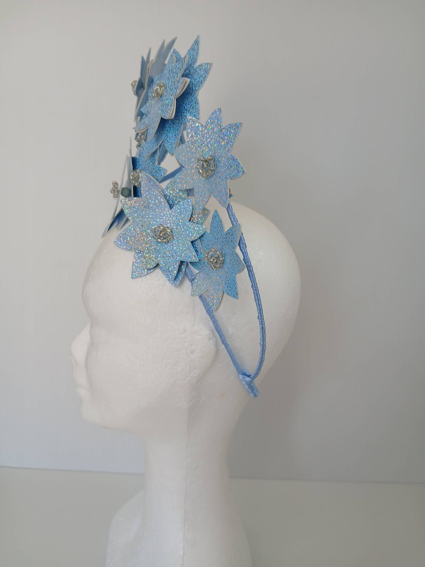 A picture is a Blue Pleather Millinery Crown by Melissa Rath Millinery