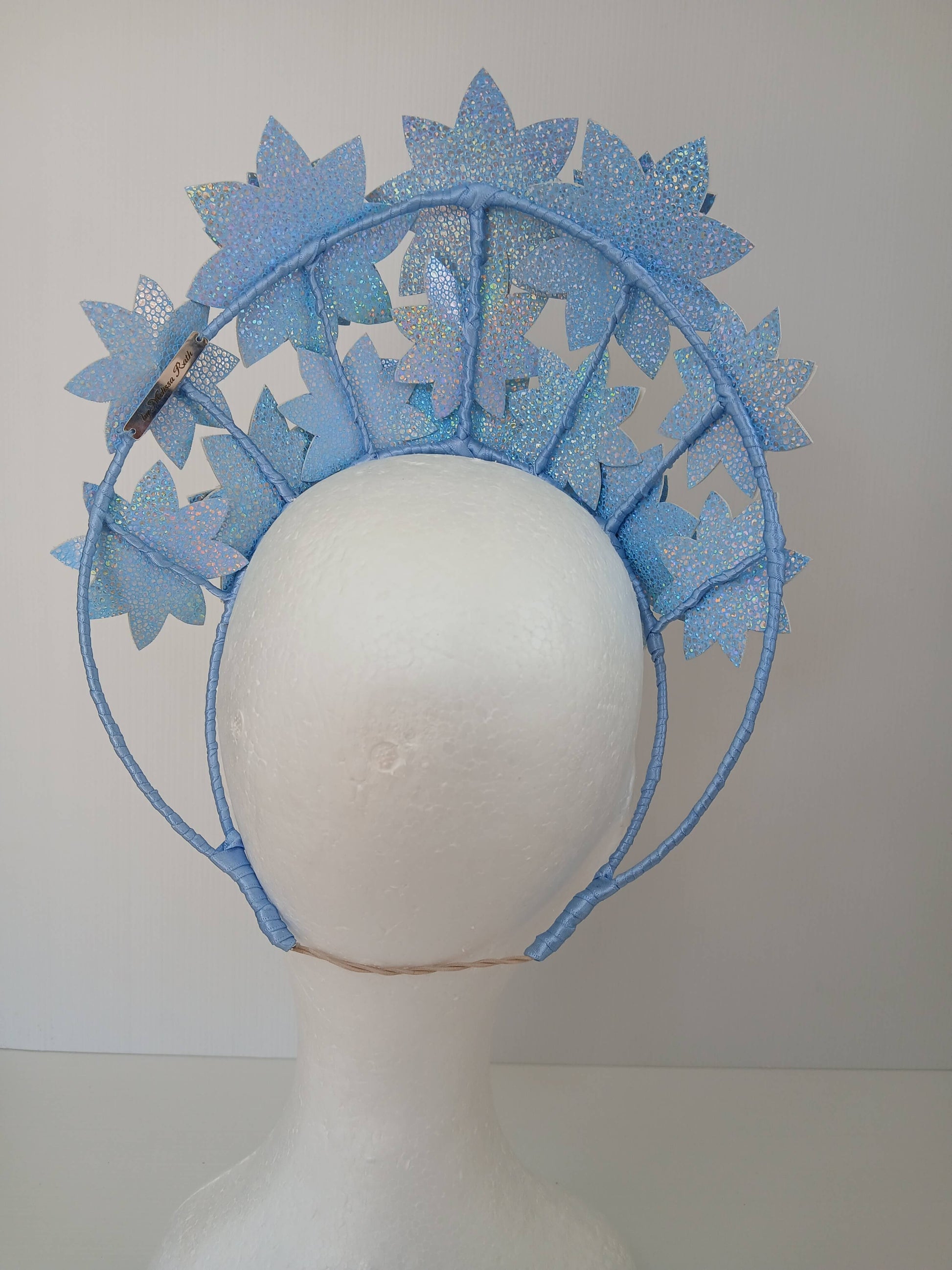 A picture is a Blue Pleather Millinery Crown by Melissa Rath Millinery