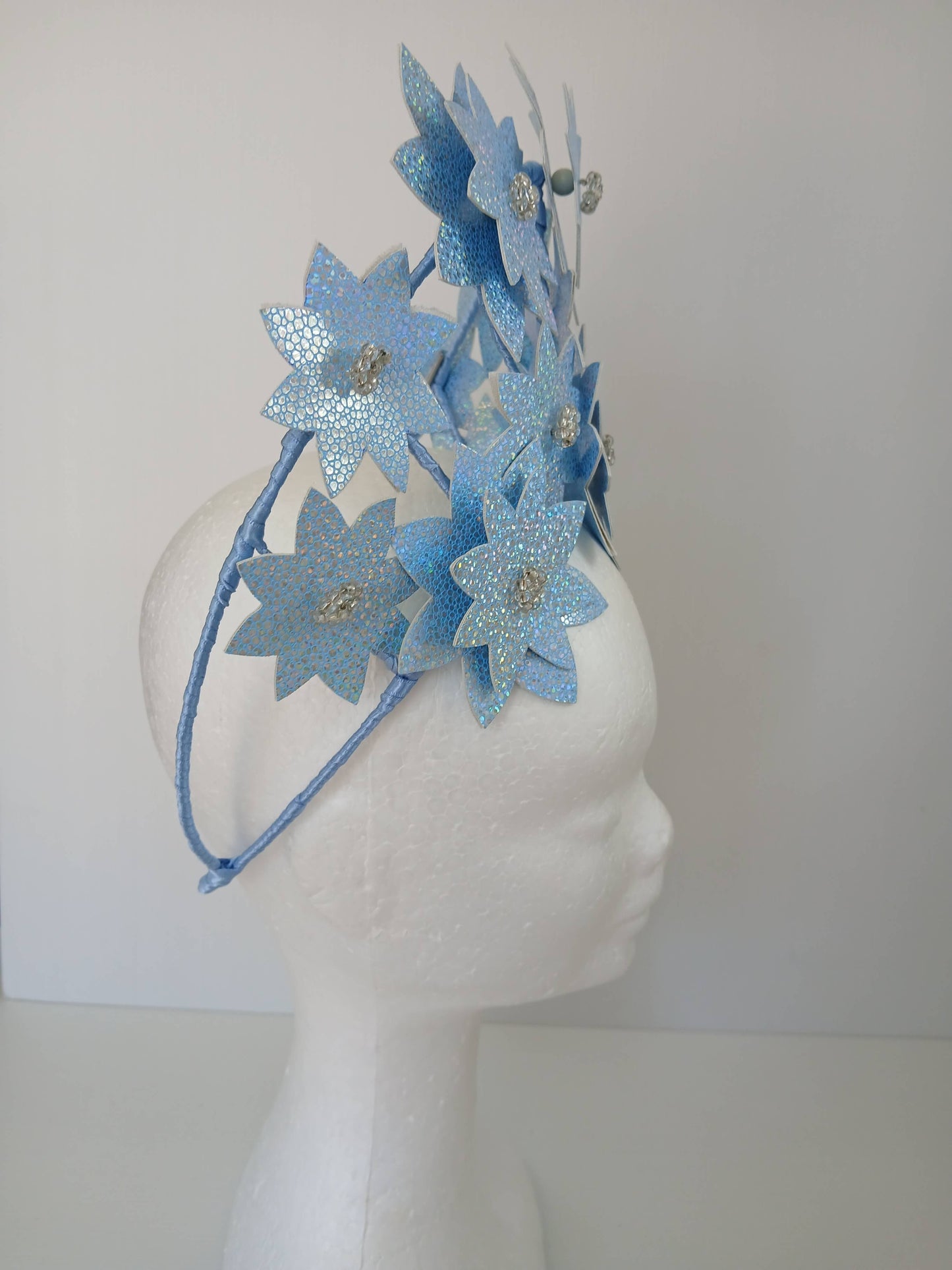 A picture is a Blue Pleather Millinery Crown by Melissa Rath Millinery