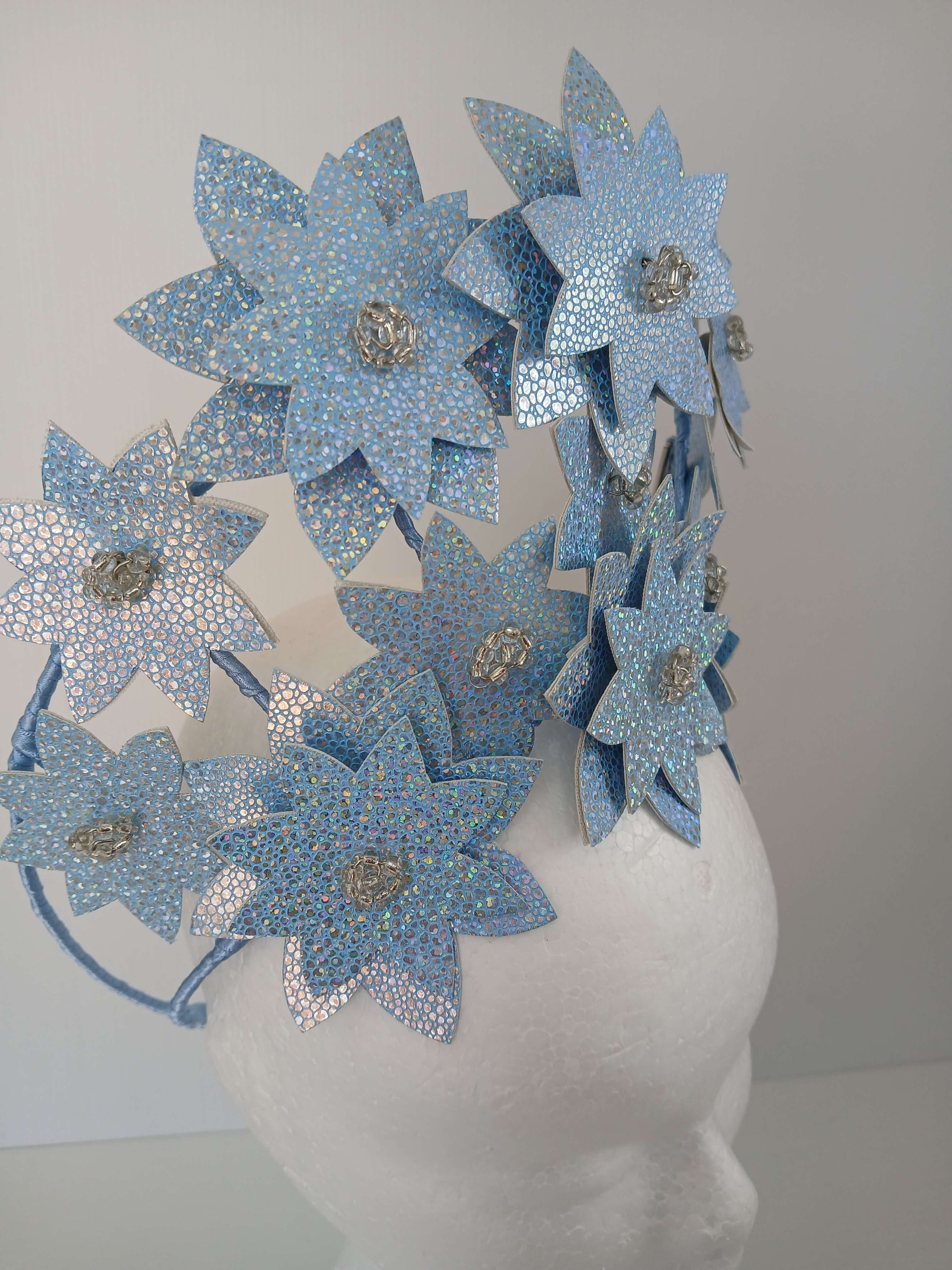 A picture is a Blue Pleather Millinery Crown by Melissa Rath Millinery