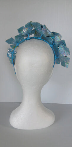 A picture of a blue pleather millinery crown by Melissa Rath Millinery.