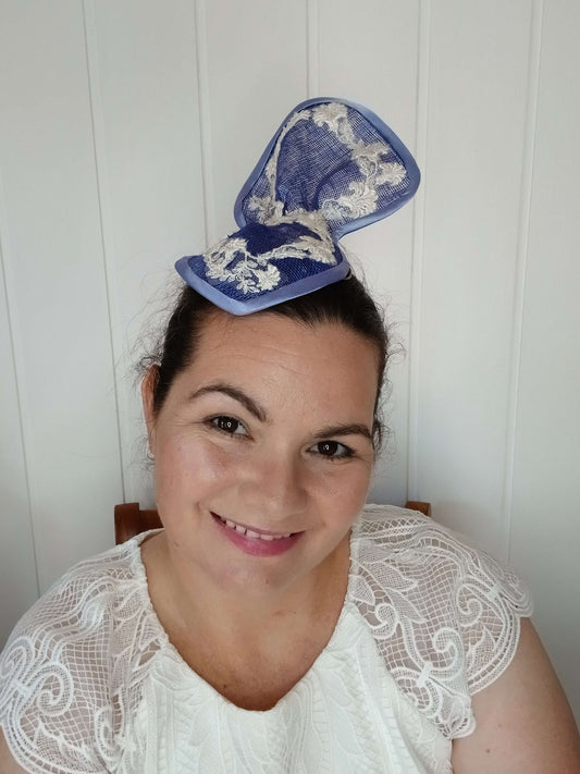 A picture of a Blue Sculptured Millinery Fascinator by Melissa Rath Millinery