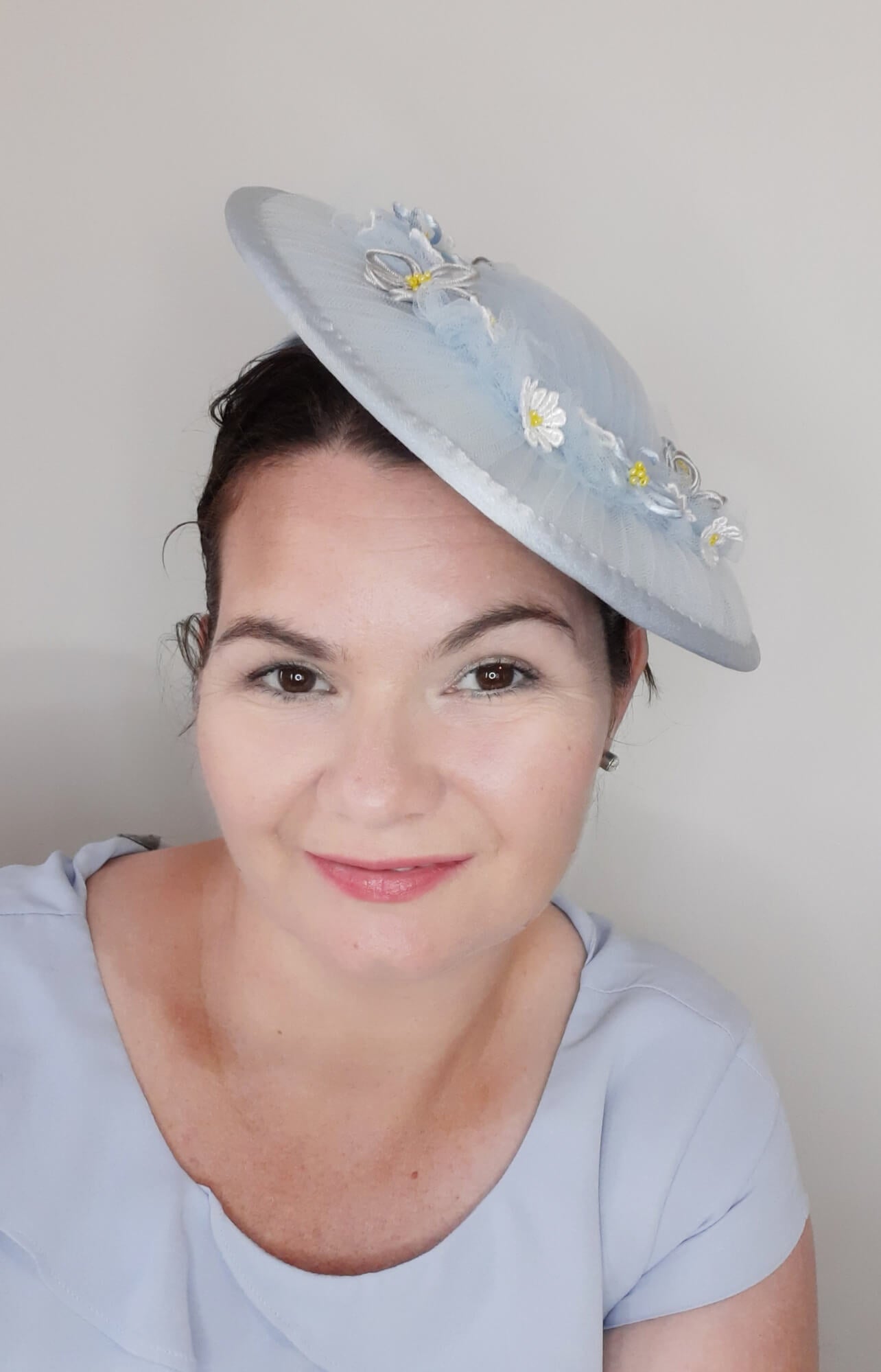 A picture of a Blue Tulle Saucer Hat by Melissa Rath Millinery.