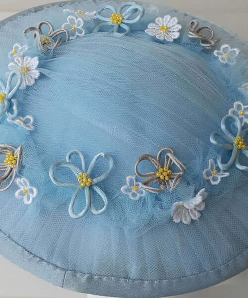 A picture of a Blue Tulle Saucer Hat by Melissa Rath Millinery.