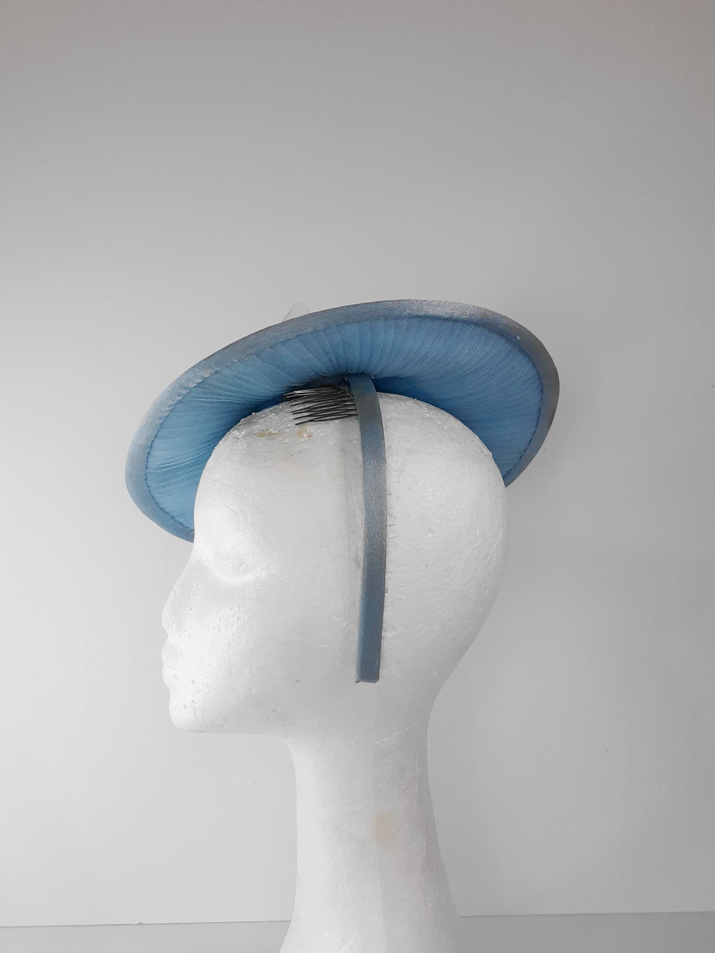 A picture of a Blue Tulle Saucer Hat by Melissa Rath Millinery.