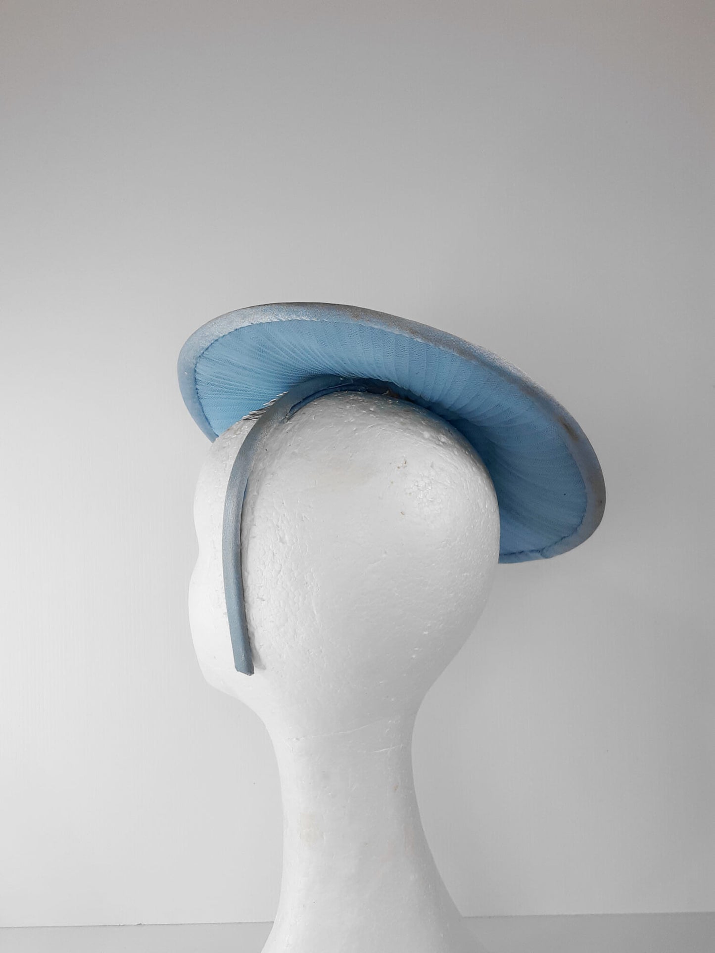 A picture of a Blue Tulle Saucer Hat by Melissa Rath Millinery.