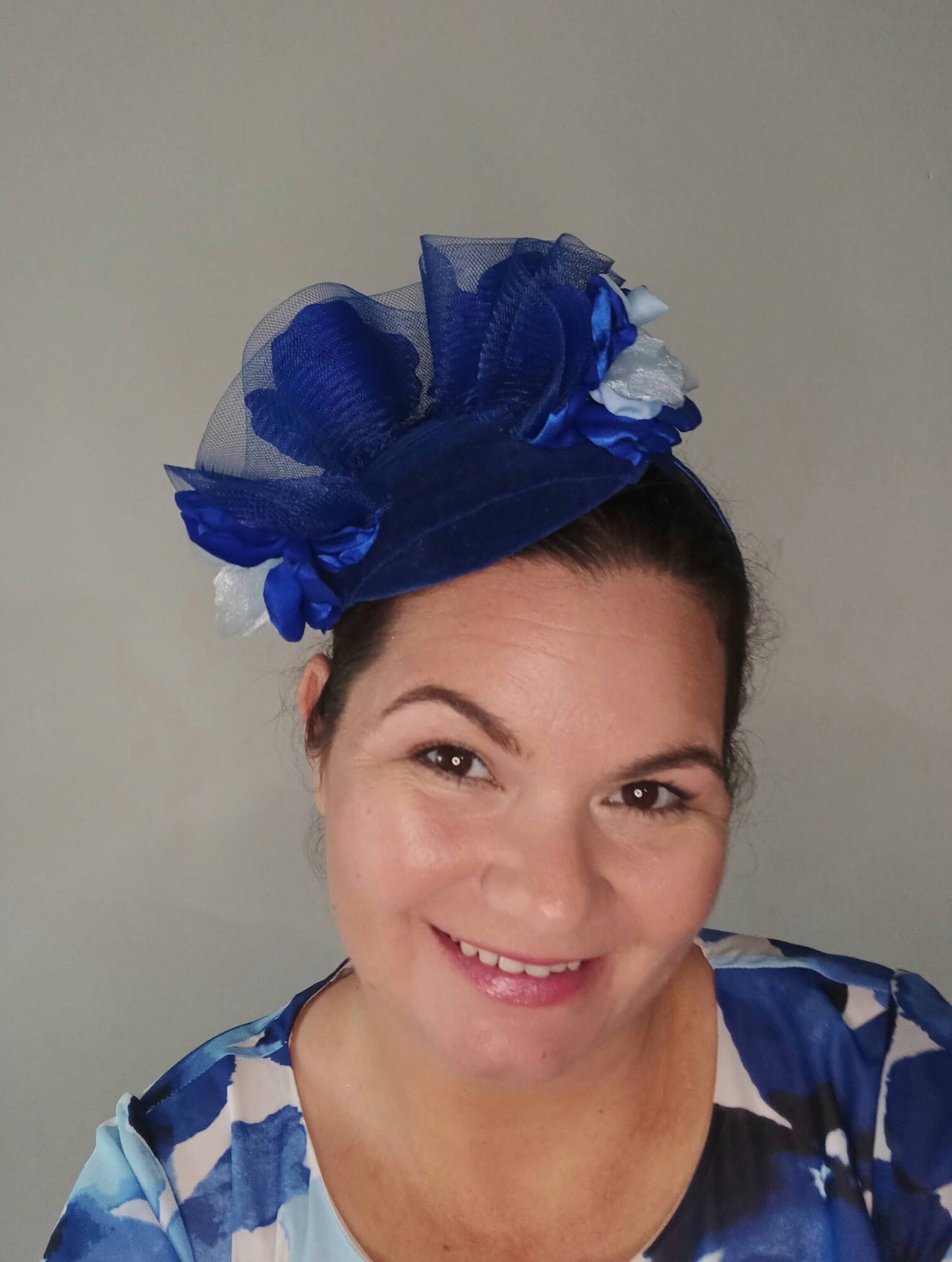 A picture of a Blue Velveteen Millinery Fascinator by Melissa Rath Millinery.