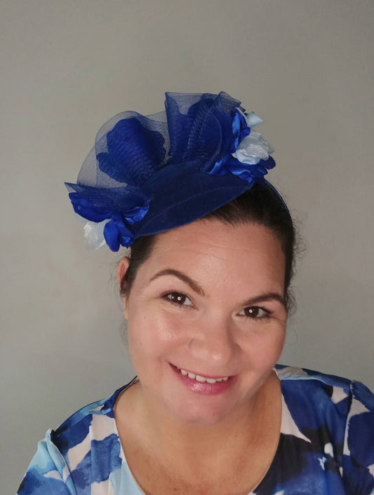 A picture of a Blue Velveteen Millinery Fascinator by Melissa Rath Millinery.
