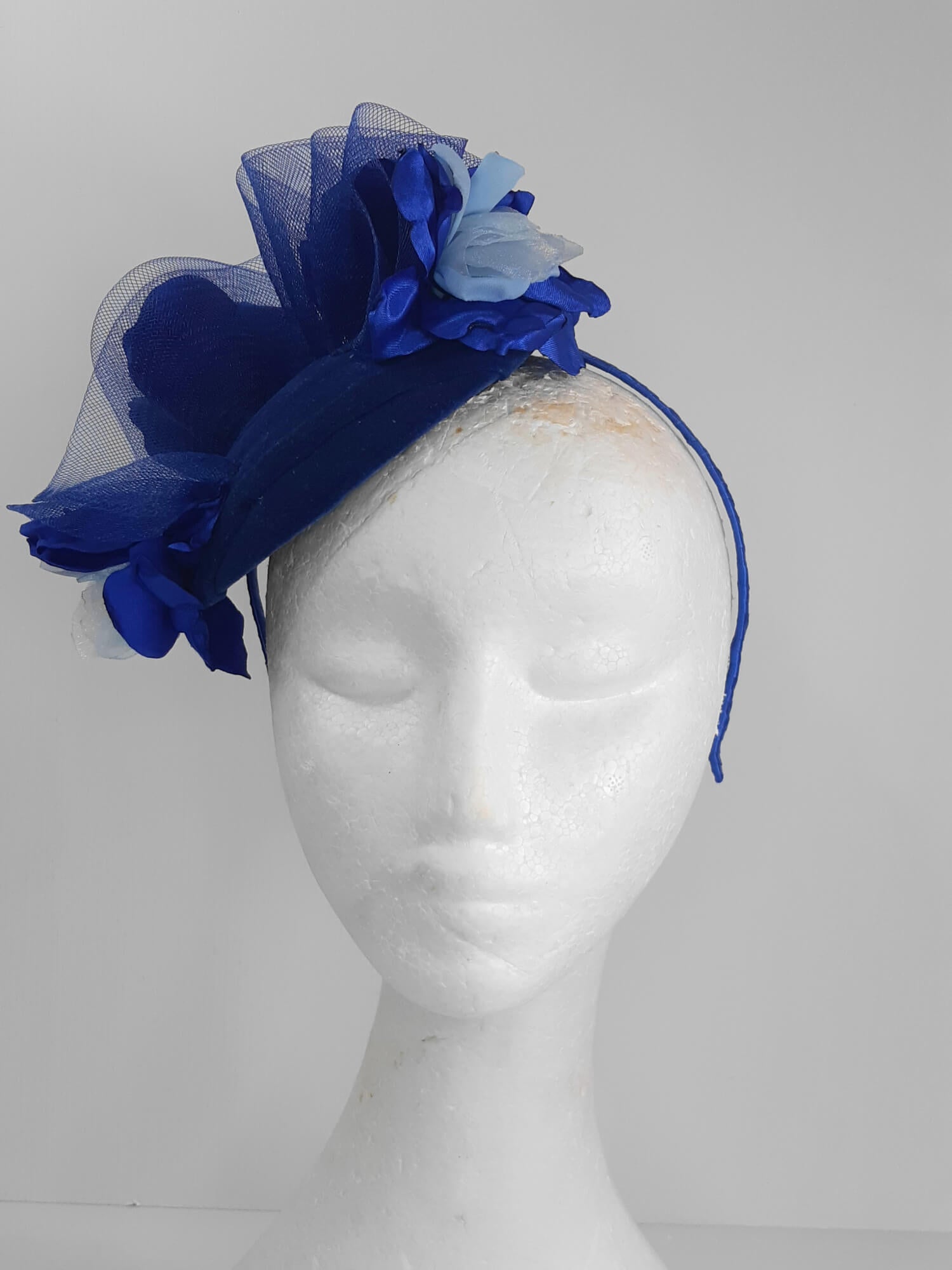 A picture of a Blue Velveteen Millinery Fascinator by Melissa Rath Millinery.