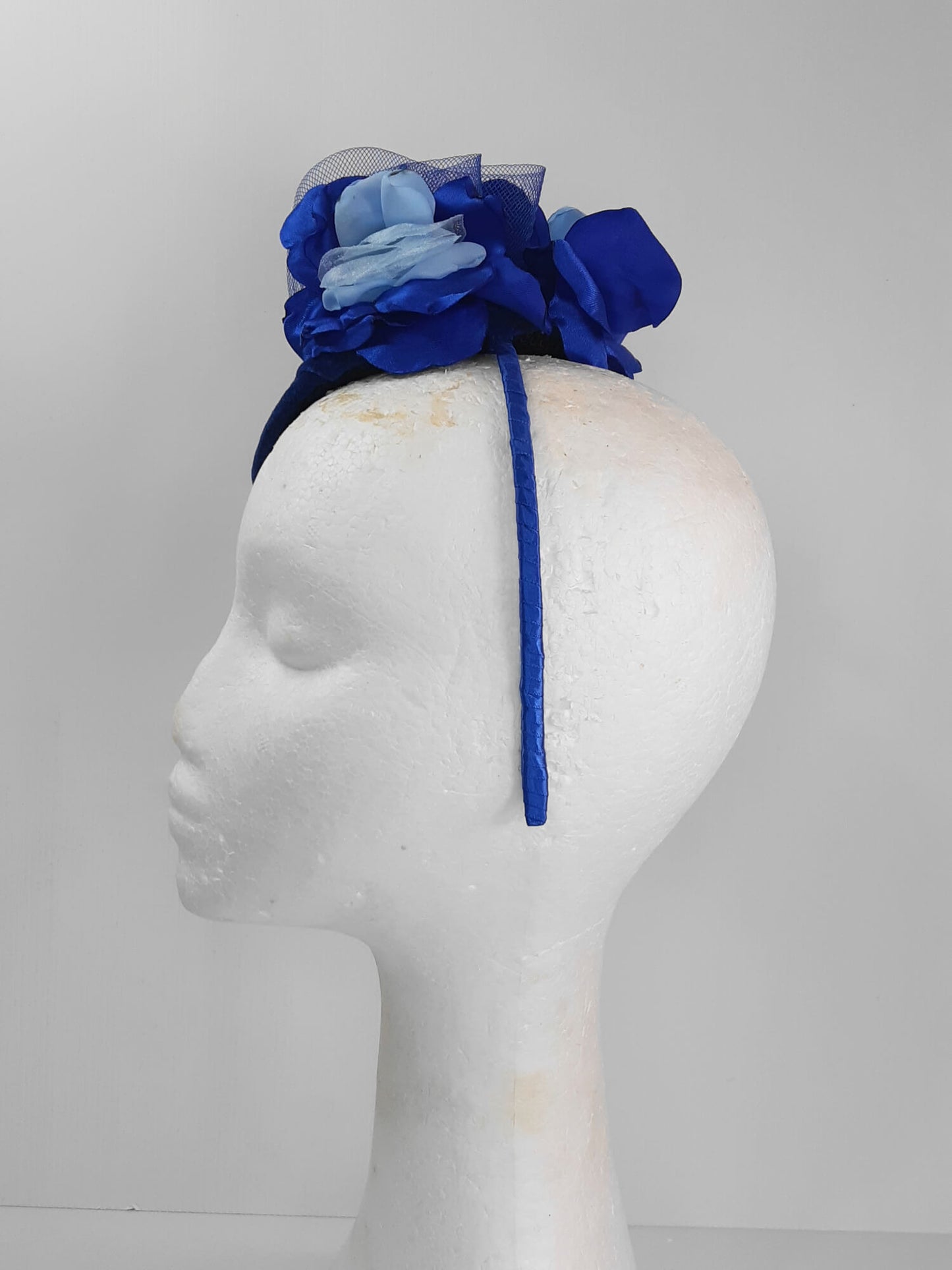 A picture of a Blue Velveteen Millinery Fascinator by Melissa Rath Millinery.