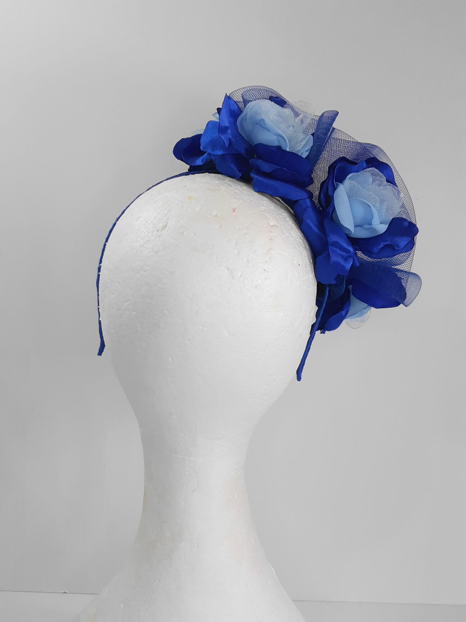 A picture of a Blue Velveteen Millinery Fascinator by Melissa Rath Millinery.