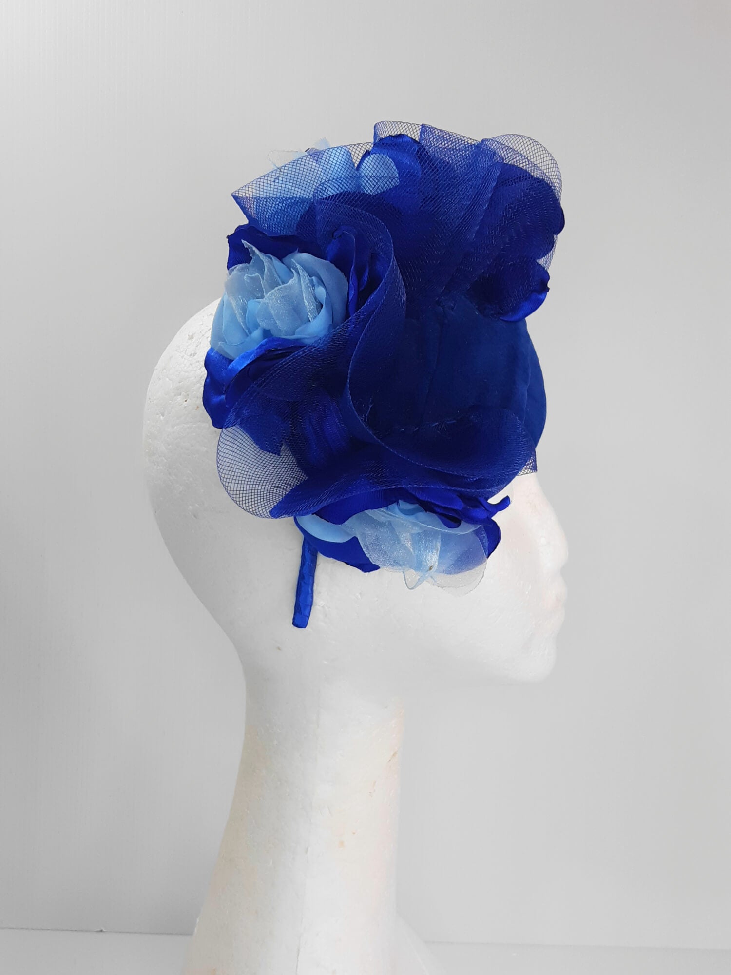 A picture of a Blue Velveteen Millinery Fascinator by Melissa Rath Millinery.
