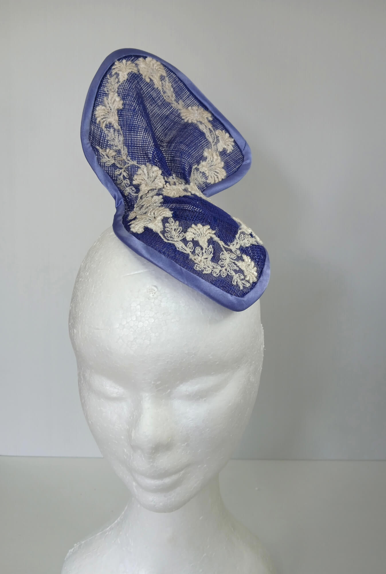 A picture of a Blue and White Sculptured Millinery Fascinator by Melissa Rath Millinery.